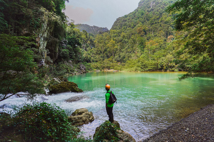 After swimming out of the underground river of Hang Ton, you will reach To Mo Valley.