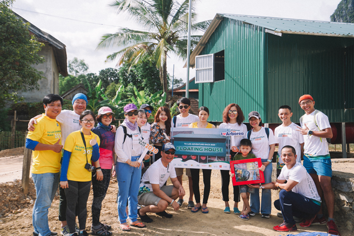Handing out the floating house for Tan Hoa villagers.